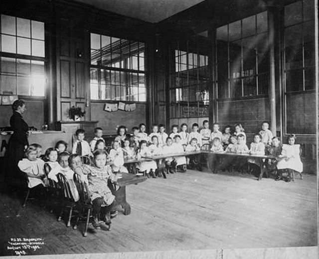 A Brooklyn public school classroom,1902, encircled in windows.